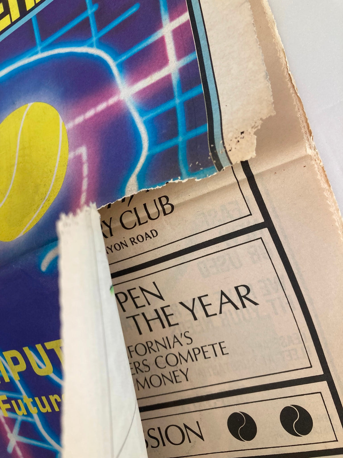 Another angle showcasing the edge of the May 1983 Inside Tennis Magazine, emphasizing the title 'Computer's The Future is Now' along with an advertisement for the California Tennis Club.