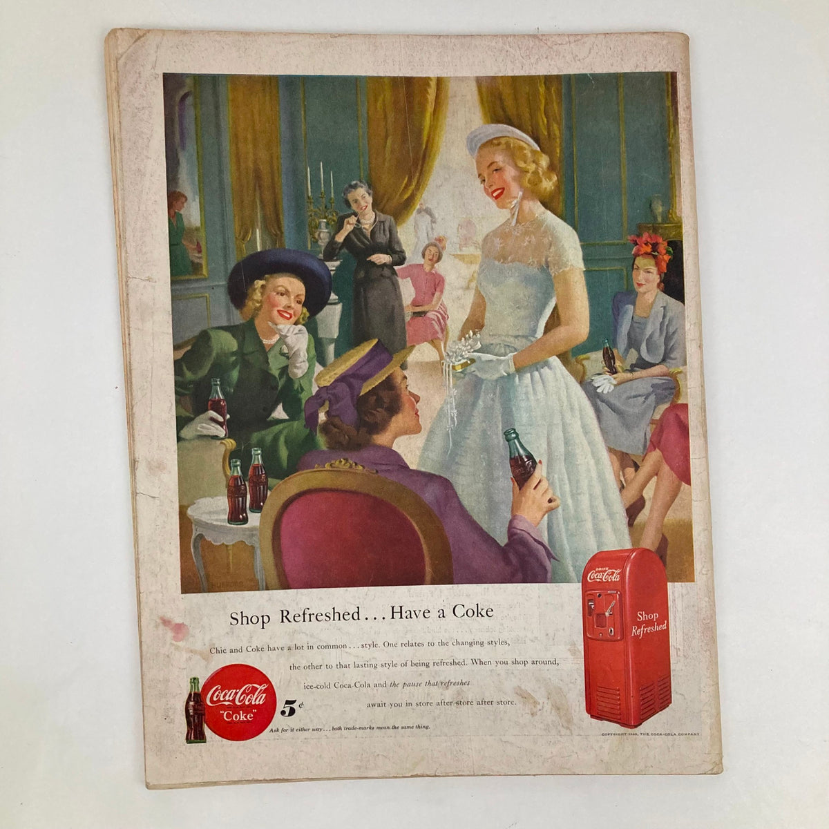 Illustrated cover of the Saturday Evening Post Magazine from May 21, 1949, featuring a vintage scene of women socializing with Coca-Cola drinks, showcasing mid-20th century Americana and the artistic style of George Hughes.