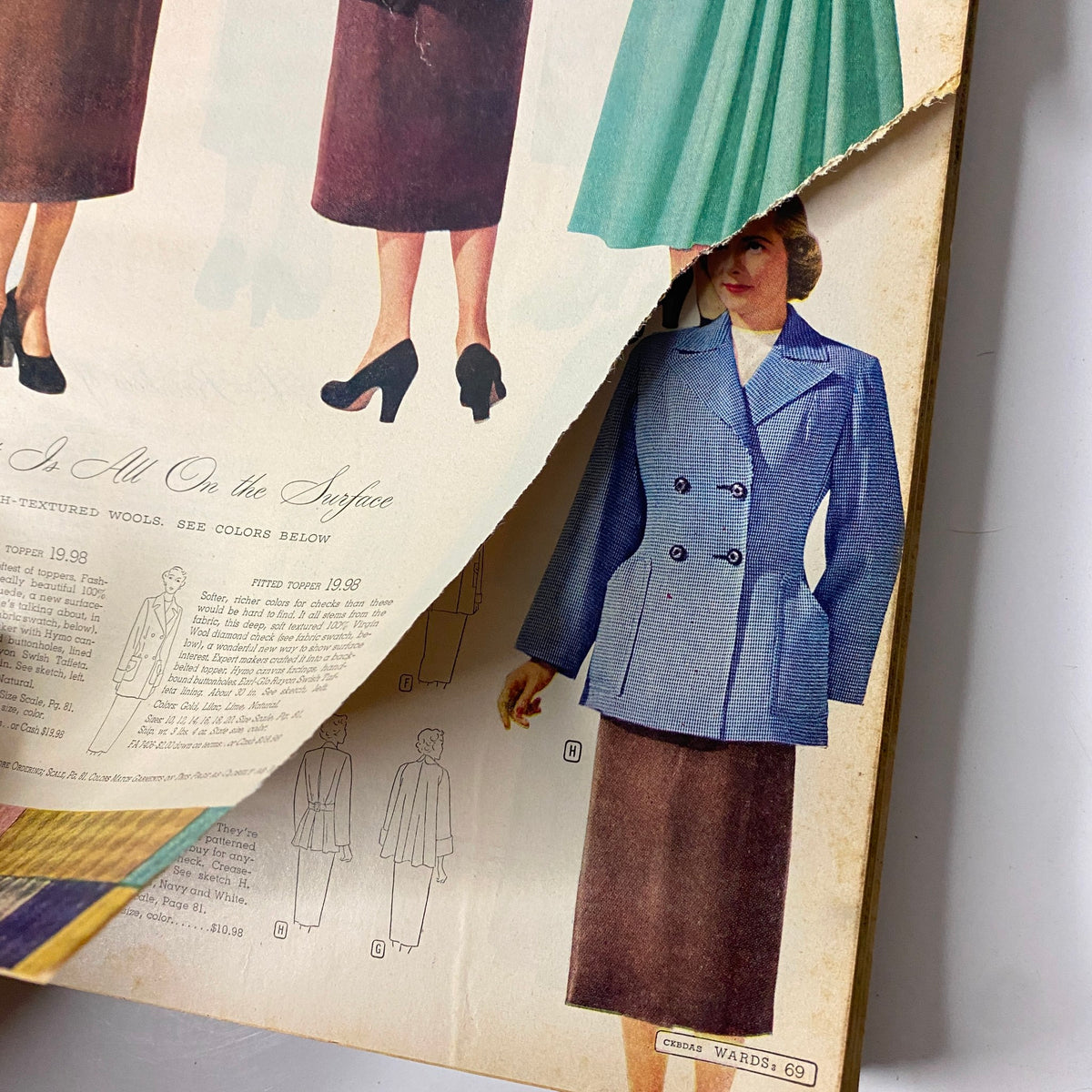 Torn page from the 1952 Montgomery Ward Albany Spring and Summer Catalog displaying stylish skirts and tops with product listings and prices.