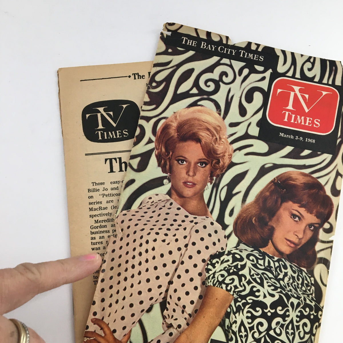 TV Times Bay City Michigan March 3-9 1968 cover positioned next to its inside cover, highlighting the Petticoat Pair-themed design with a woman pointing to the text.
