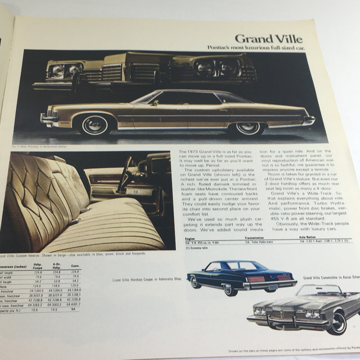 1973 Pontiac Grand Prix & Ville/Bonneville Dealership Car Auto Brochure Catalog page detailing the Grand Ville model, highlighting luxurious interior upholstery and features, alongside exterior images of the vehicle.