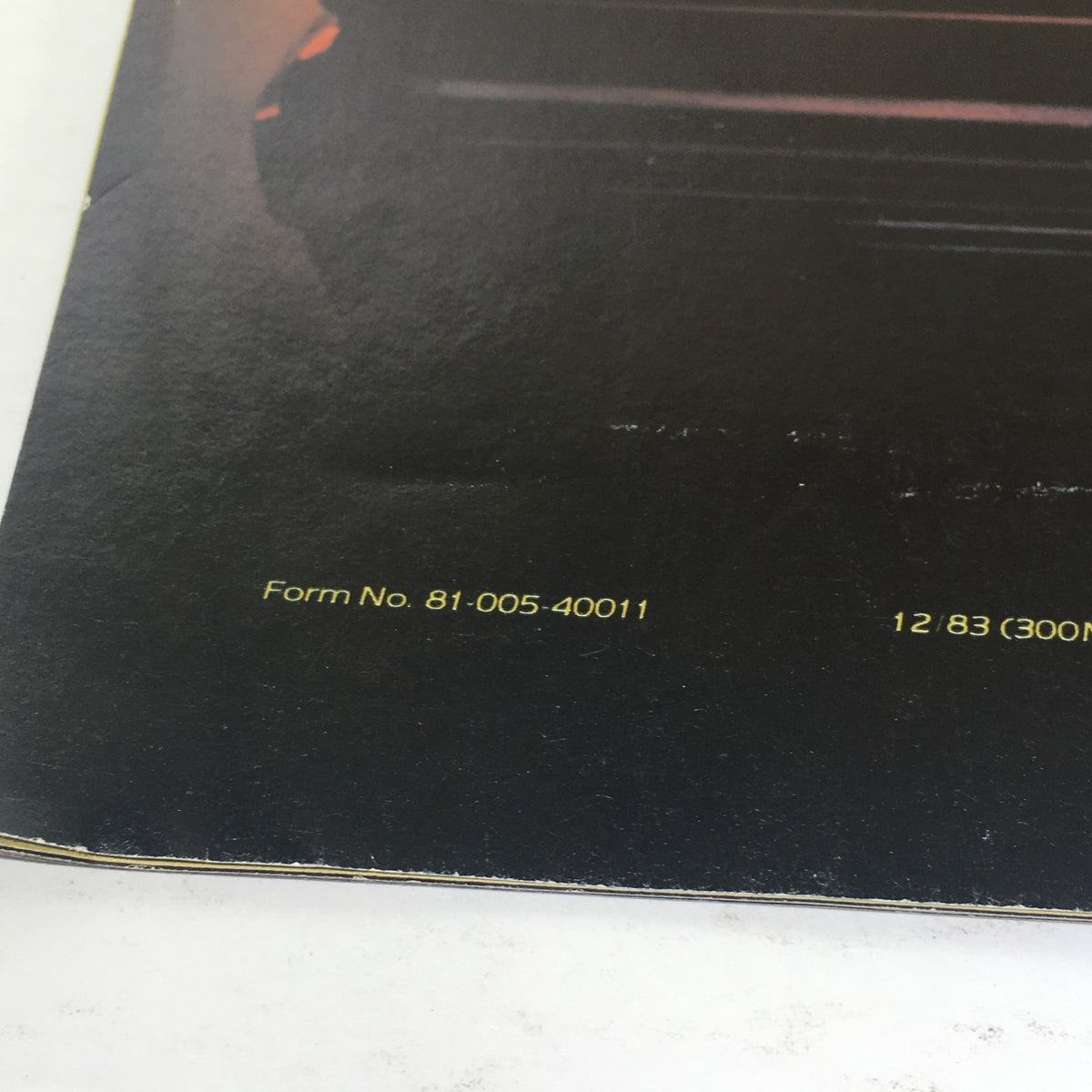 Detailed close-up of the Form #81005-40011 listing on the back of the 1984 Laser XE by Chrysler brochure.