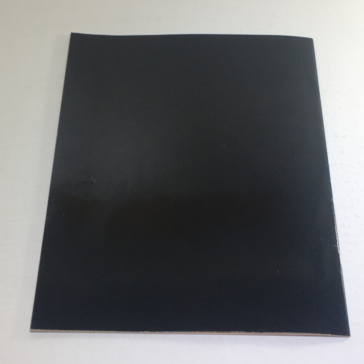 Back cover of the 1975 MG Sports Car Dealership Car Auto Brochure Catalog, featuring a plain black design.