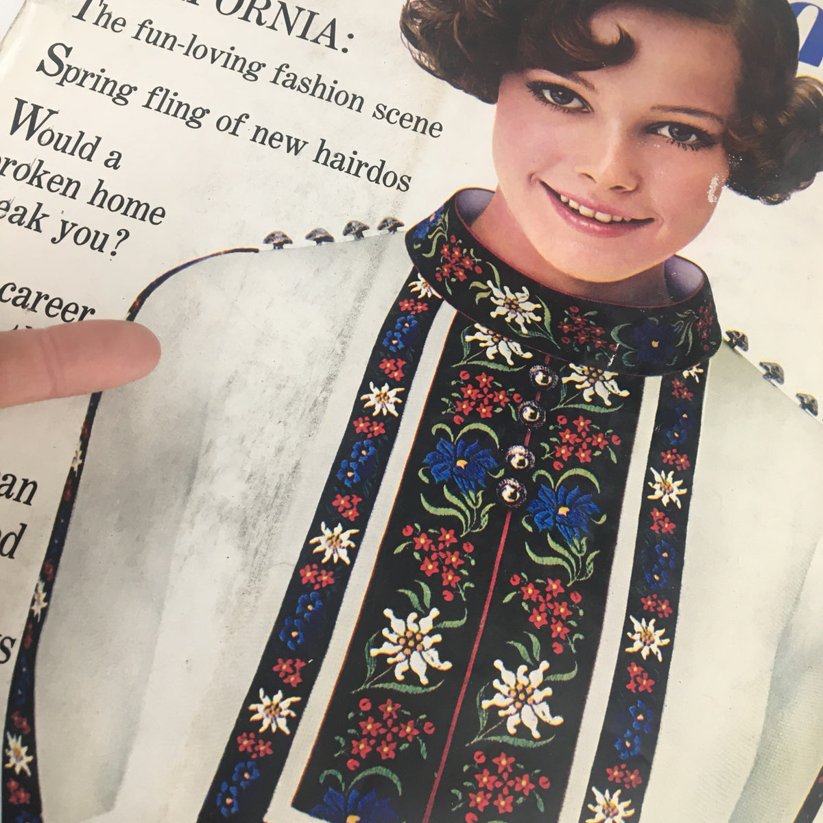 Close-up of the March 1968 Seventeen Magazine cover titled 'The Career Where The Action Is' highlighting the floral embroidered design on the collar and the smiling young woman.