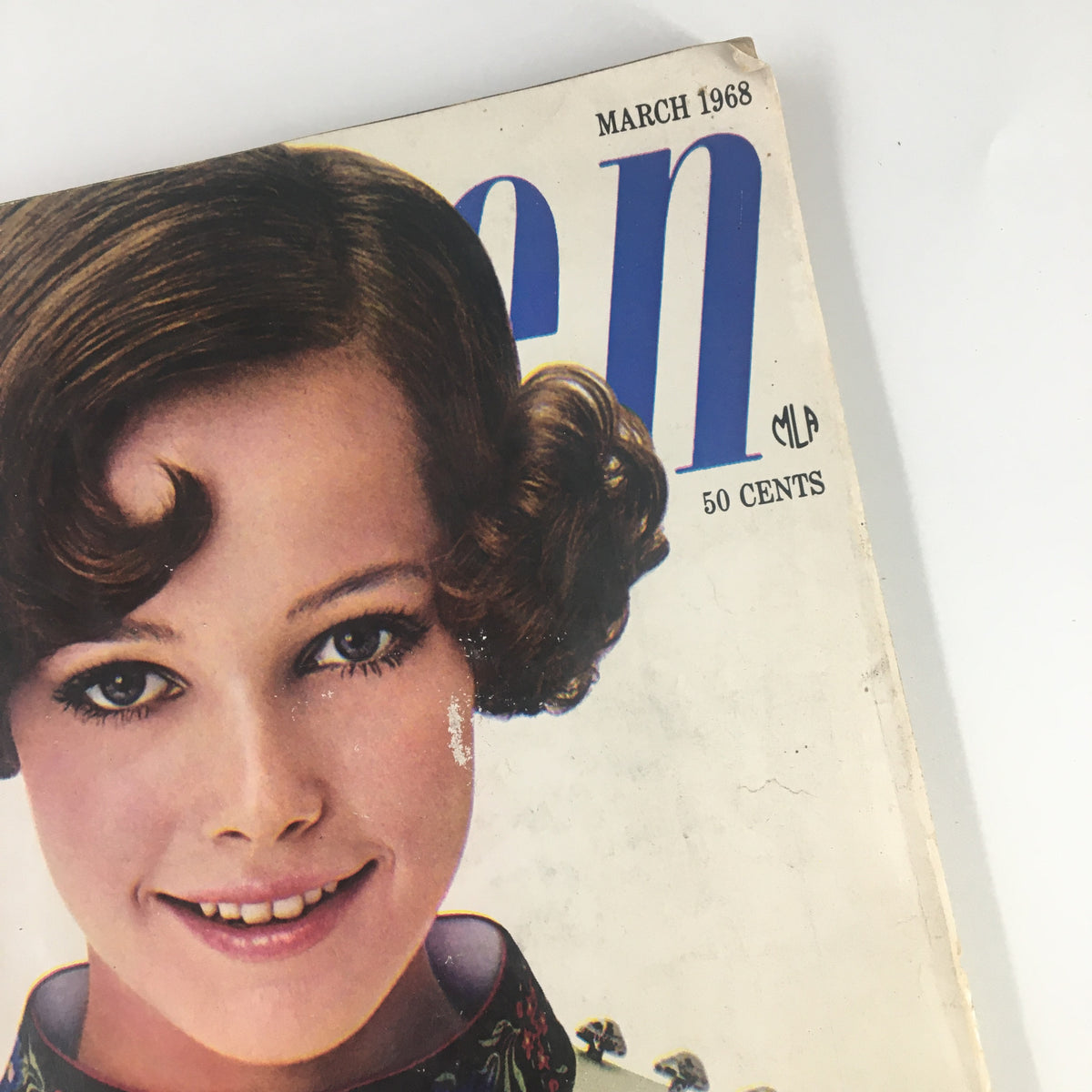 Detailed view of the March 1968 Seventeen Magazine cover featuring a young woman with curly hair and an embroidered collar, emphasizing the magazine's title 'The Career Where The Action Is'.