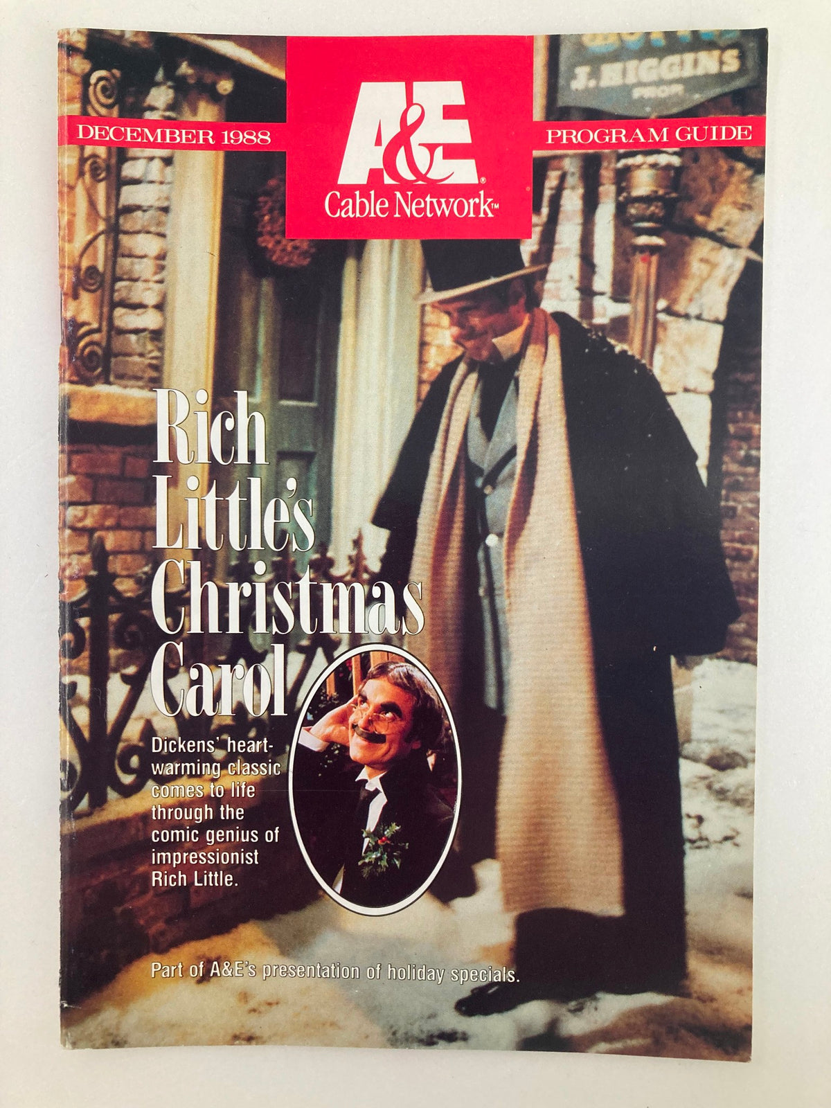 Vintage A&E Cable Network Program Guide from December 1988 featuring Rich Little's Christmas Carol, showcasing a top-hat wearing character and festive imagery.