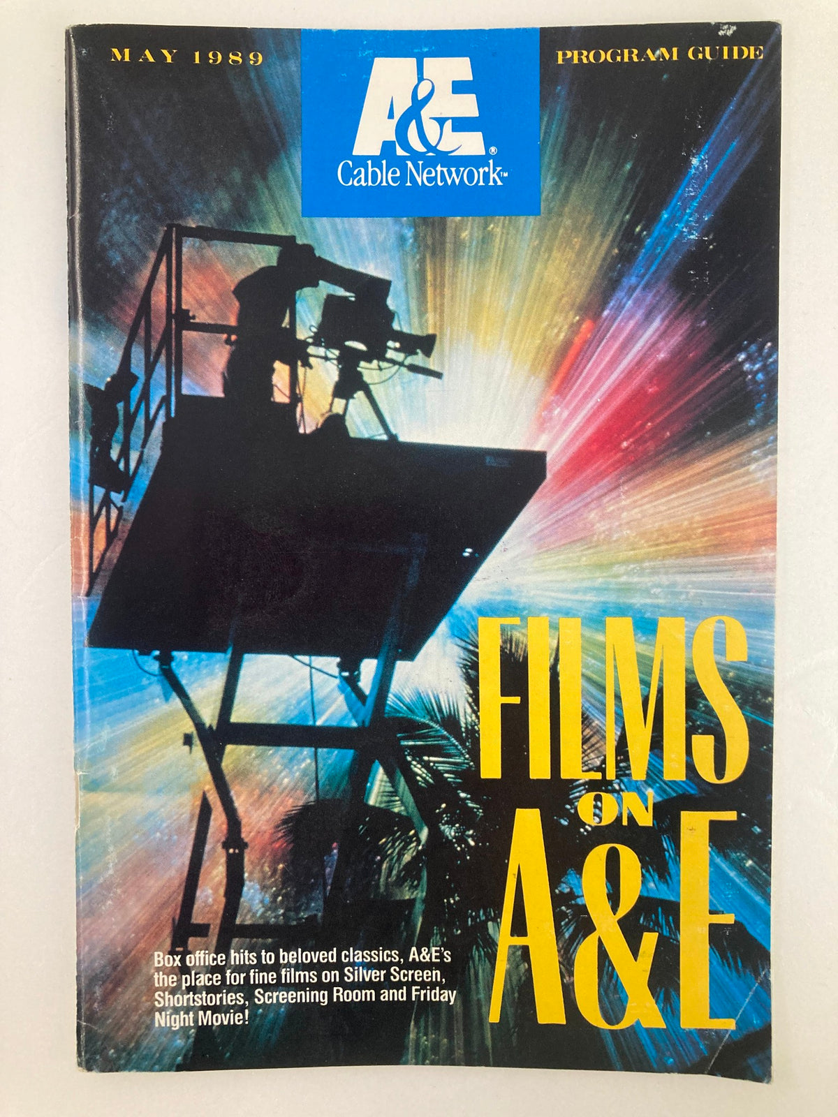 VTG A&E Cable Network Program Guide May 1989 featuring a colorful cover highlighting films on A&E, showcasing the vintage artwork and theme.