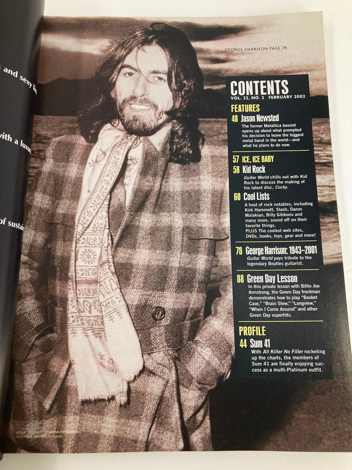 Guitar World Magazine February 2002 featuring George Harrison, page displaying contents with detailed list, includes a tribute to Harrison (1943-2001), highlighting features on various artists and topics.