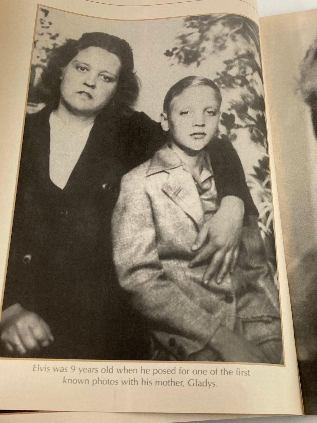 Inside page of VTG Remembering Elvis Magazine 2002 featuring a historical photo of young Elvis Presley with his mother, Gladys, highlighting his early life.