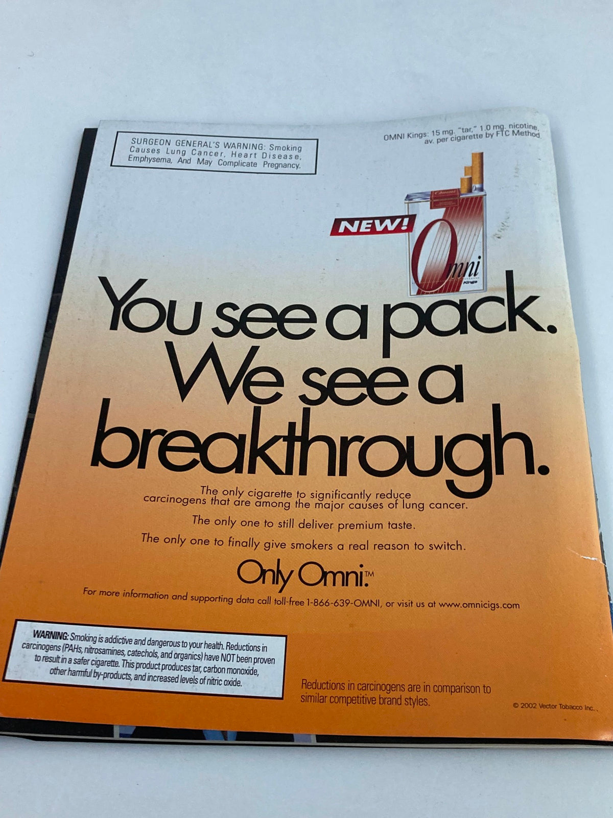 Back cover of VTG Remembering Elvis Magazine 2002 displaying an advertisement for Omni cigarettes, highlighting a smoking warning and product information.