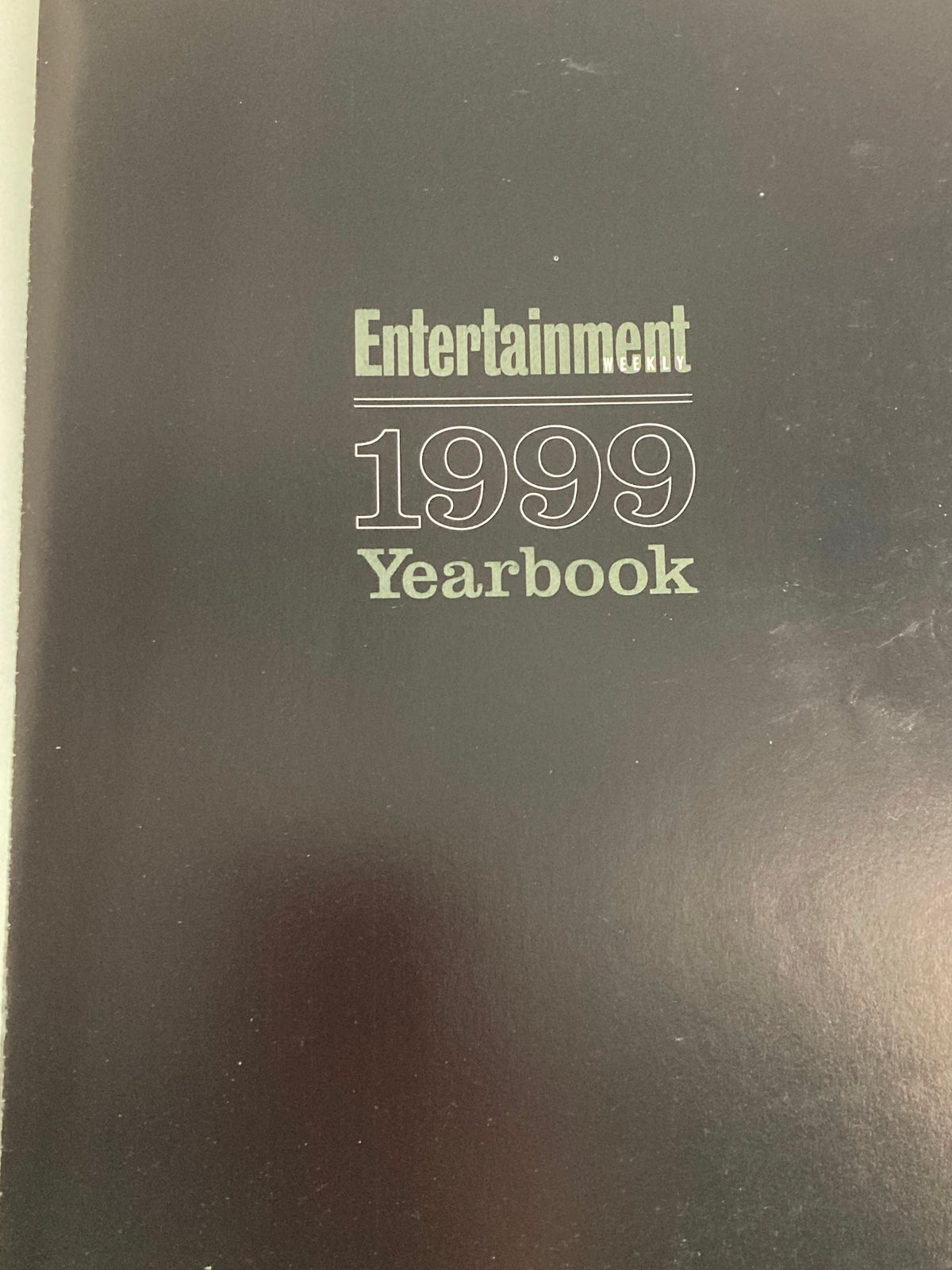 Cover of the VTG Entertainment Weekly Yearbook 1999 featuring the year and title prominently, showcasing a black background.