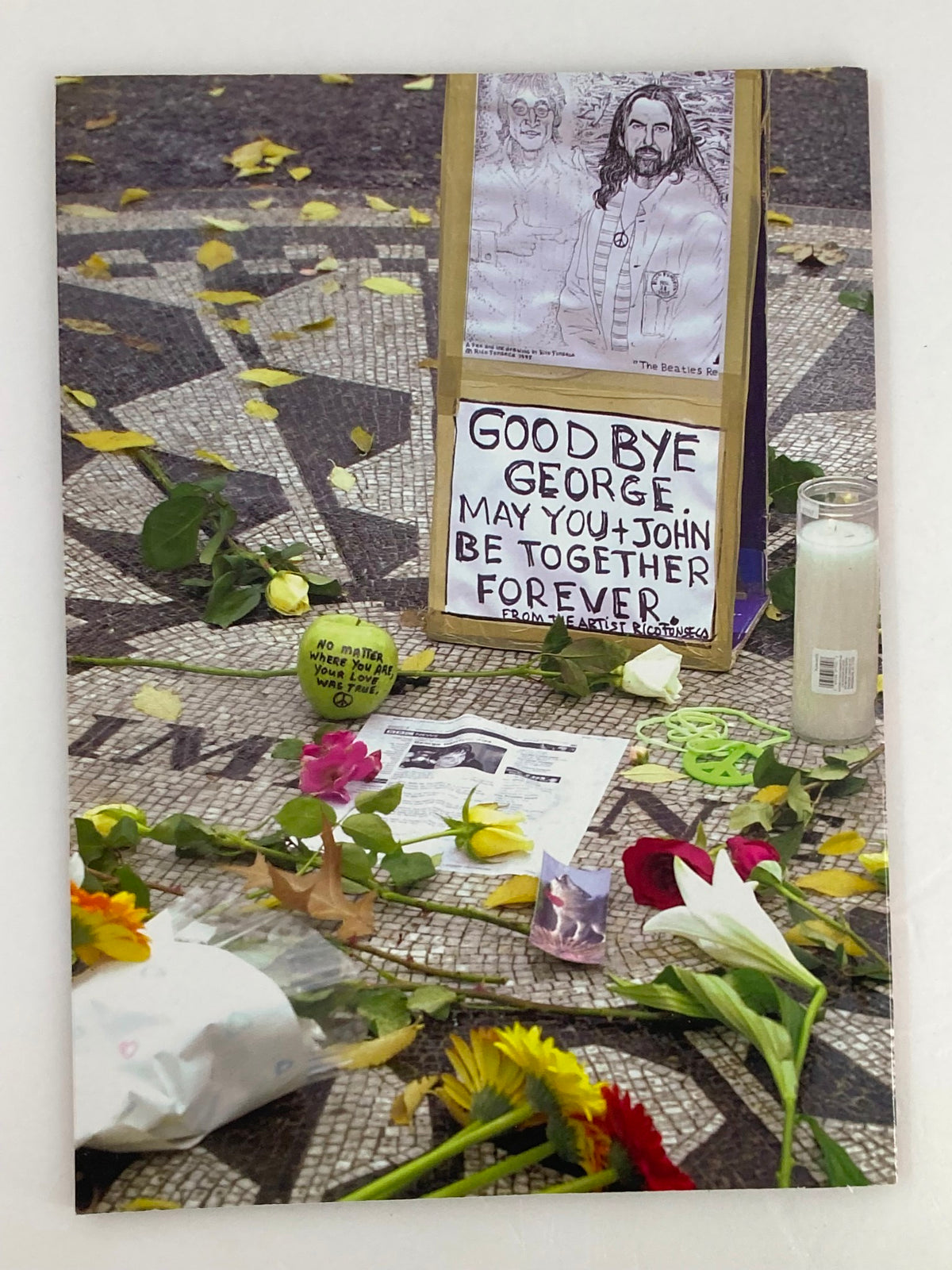 Gold Collectors Series Magazine 2001 A Tribute To George Harrison depicting a memorial arrangement with flowers, candles, and messages honoring George Harrison.