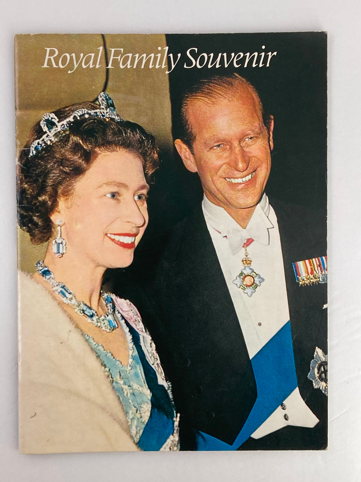 VTG Royal Family Souvenir 1973 Picture Book cover featuring Queen Elizabeth II and Prince Philip, showcasing their elegant attire and smiles.