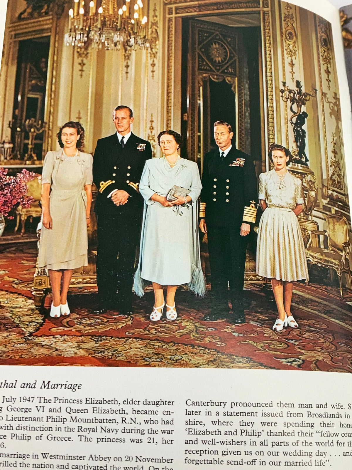 A page from the VTG Royal Family Souvenir 1973 Picture Book depicting the royal family in formal attire, commemorating Princess Elizabeth's marriage with Prince Philip.
