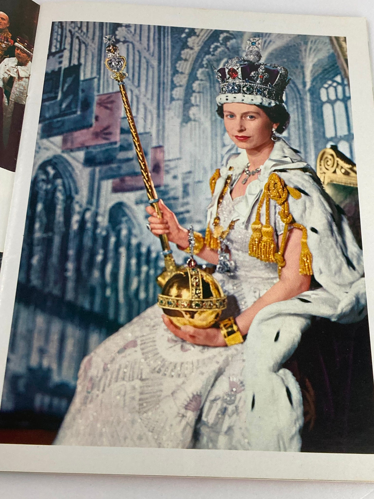 VTG Royal Family Souvenir 1973 Picture Book Queen Elizabeth II & Prince Phillip depicting Queen Elizabeth II in ceremonial regalia during a royal event, conveying the grandeur of her reign.
