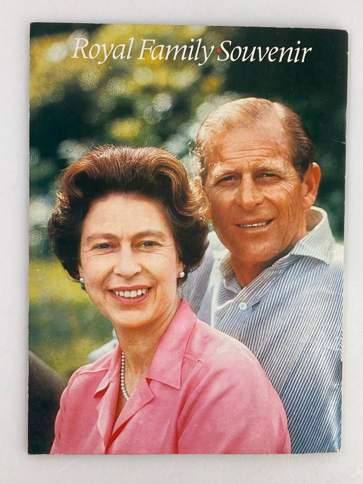 VTG Royal Family Souvenir 1973 Picture Book cover featuring Queen Elizabeth II and Prince Phillip in a warm outdoor setting.