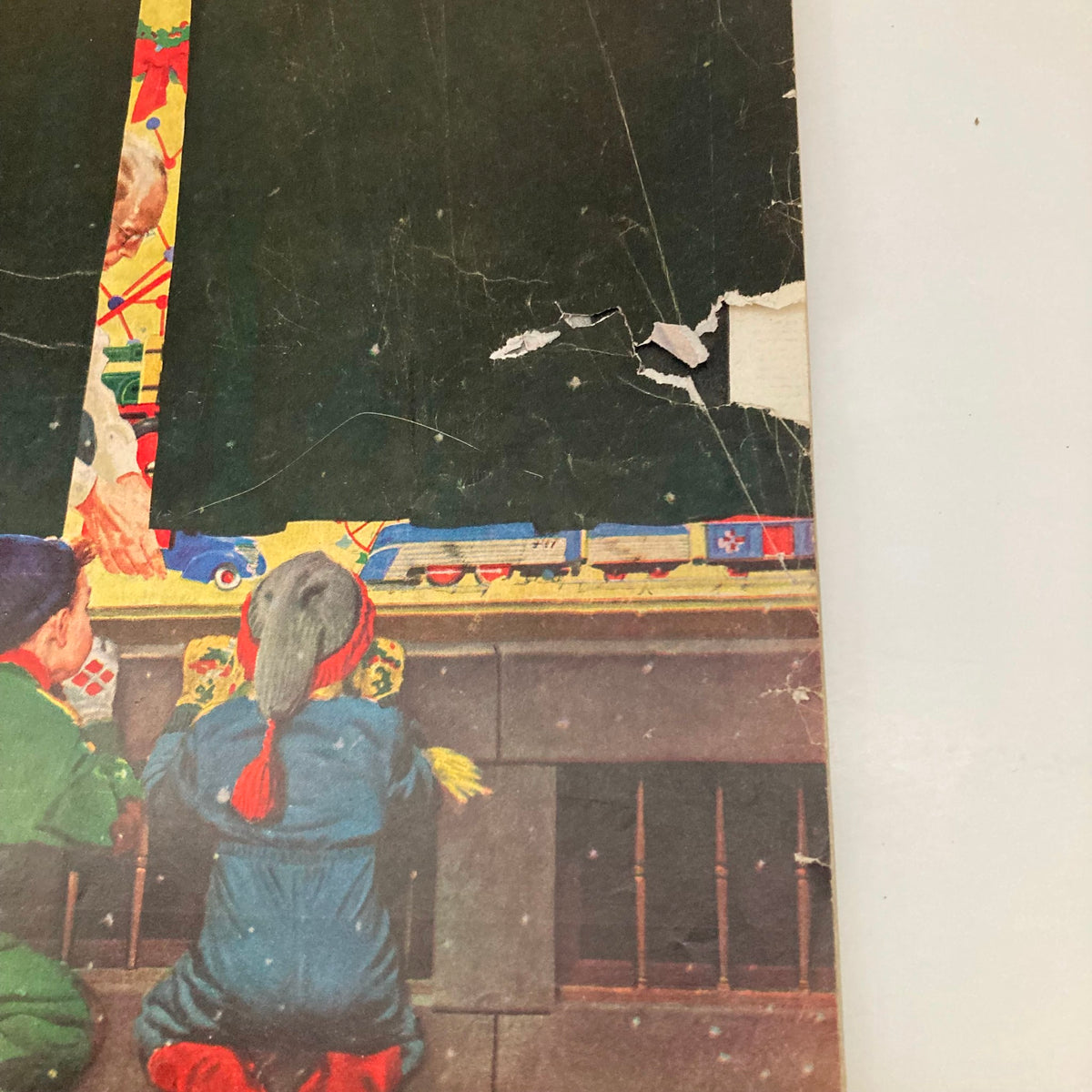 Close-up of the Saturday Evening Post Magazine cover from December 9, 1950, showcasing kids admiring a holiday window display, illustrated by Coby Whitmore.