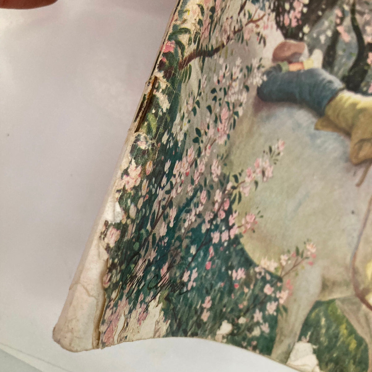 Close-up view of the edge of the Saturday Evening Post Magazine May 6 1950 cover by John Clymer, highlighting the wear and tear that adds to its vintage charm.
