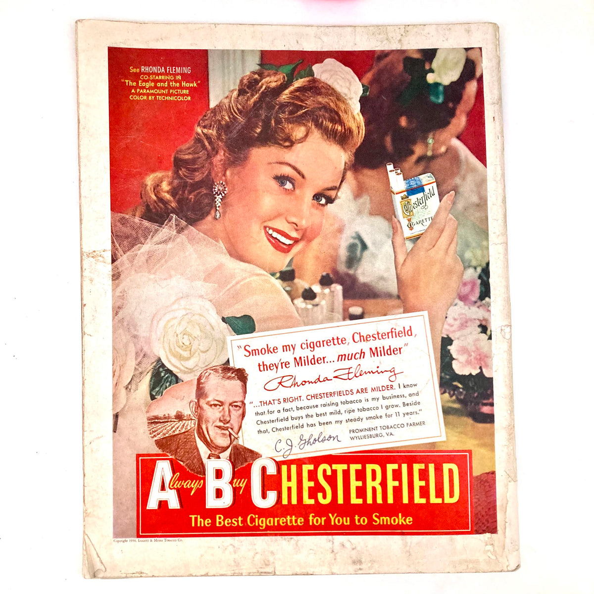 Vintage advertisement in the Saturday Evening Post Magazine May 6 1950 featuring a smiling woman promoting Chesterfield cigarettes with an elegant setting.