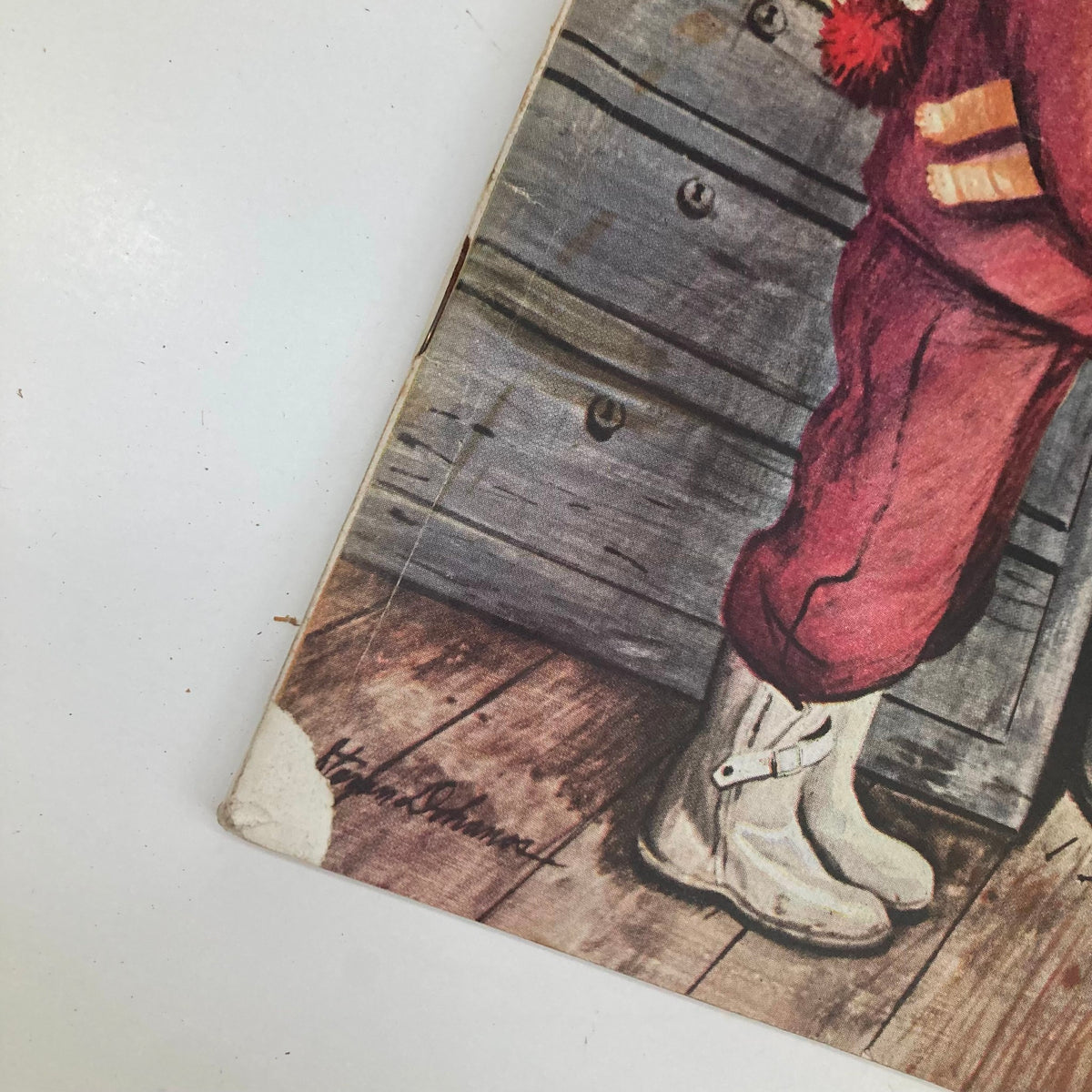 Close-up detail of the illustrated cover from the Saturday Evening Post Magazine, November 12, 1949, showcasing artist Stevan Dohanos' signature and the charming depiction of a young girl in winter attire.