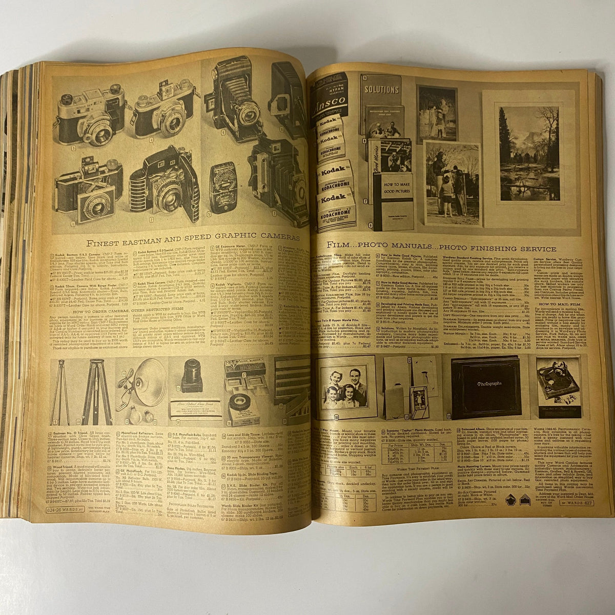 Camera product page from the 1945 Montgomery Ward Spring and Summer Catalog illustrating various cameras and photo equipment.