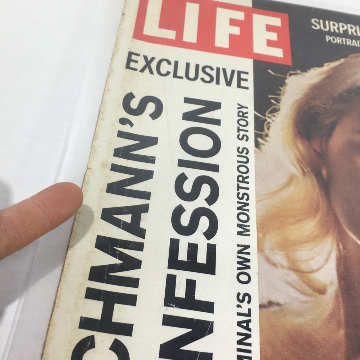 Close-up view of the vintage Life Magazine cover from November 28, 1960, highlighting the title 'Exclusive Eichmann's Confession' and featuring Carroll Baker.