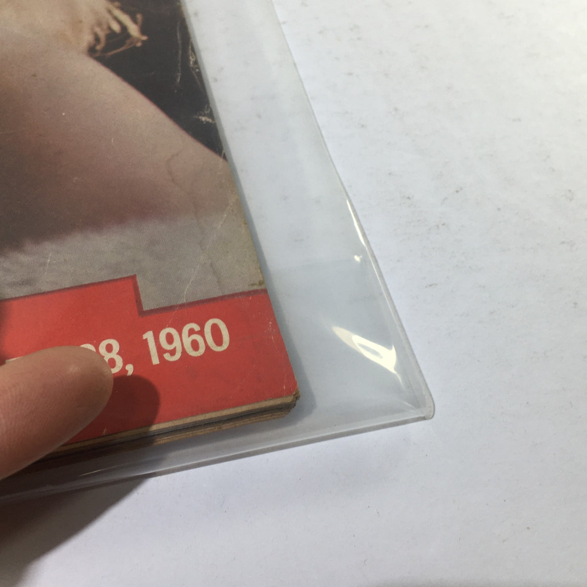 Corner detail of the vintage Life Magazine cover dated November 28, 1960, showing the date and section of the cover featuring Carroll Baker.