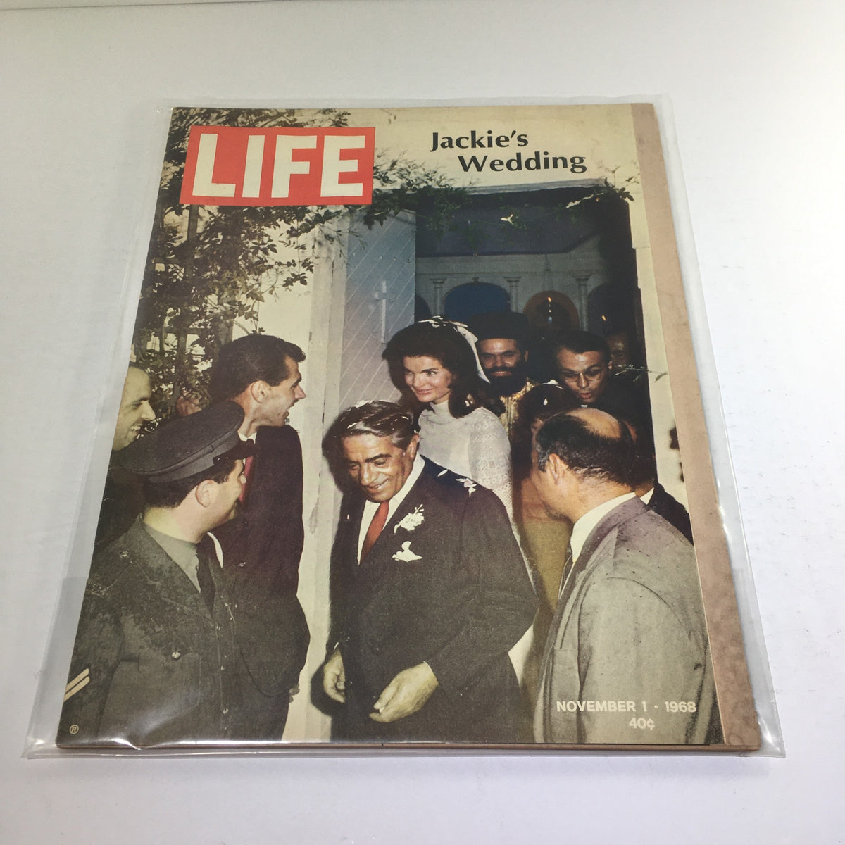 Vintage Life Magazine cover from November 1, 1968, featuring Jackie Kennedy's wedding, showcasing a moment with guests at the event.