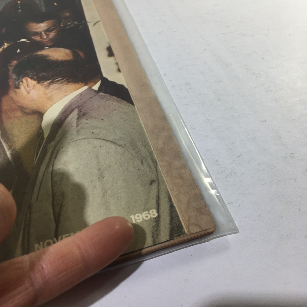 Close-up of the corner of a vintage Life Magazine from November 1, 1968, featuring Jackie Kennedy's wedding on the cover, showcasing light wear and character.