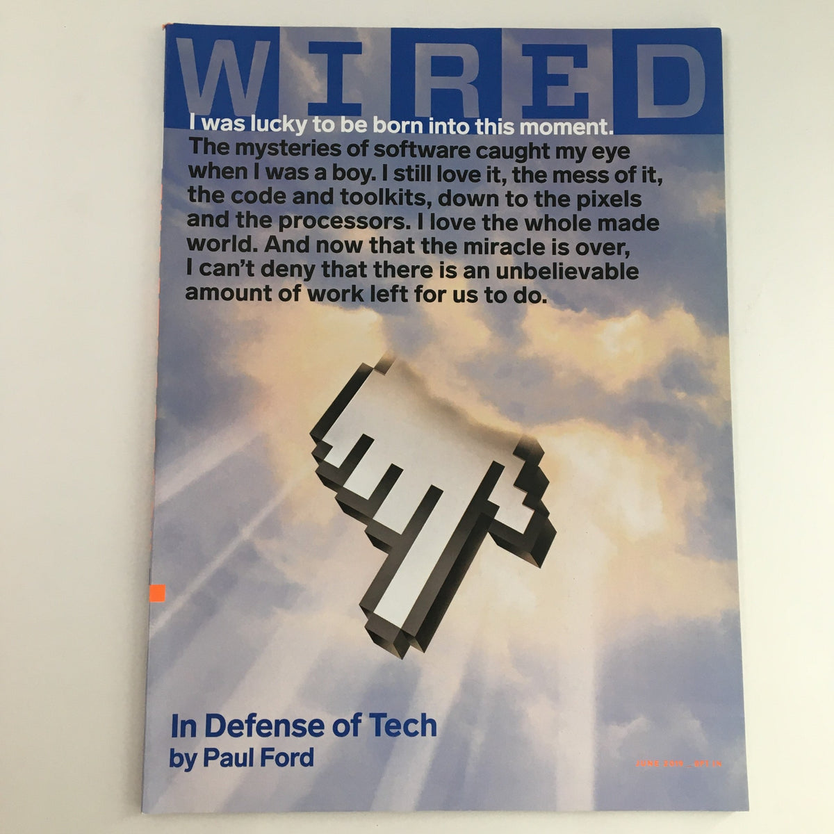 Cover of Wired Magazine June 2019 featuring the title 'In Defense of Tech' by Paul Ford, showcasing a pixelated hand cursor graphic. This collectible issue reflects on technology's impact on society.