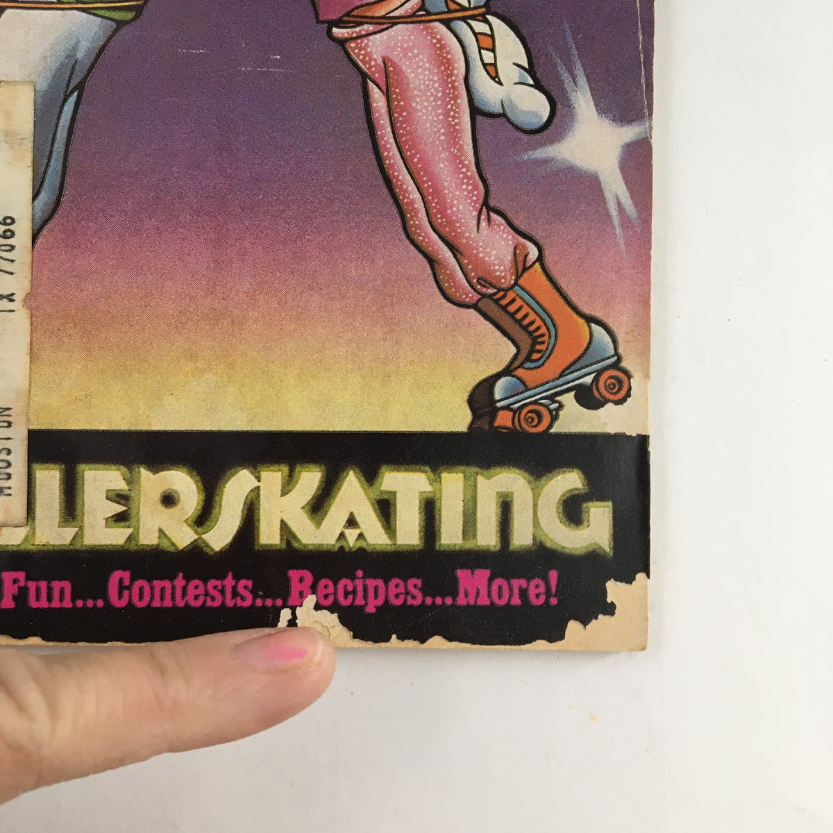 Close-up of the cover of Young Miss Magazine November 1979, showcasing the bold title 'ROLLER SKATING' and playful graphics, emphasizing the theme of roller fun, contests, and recipes.