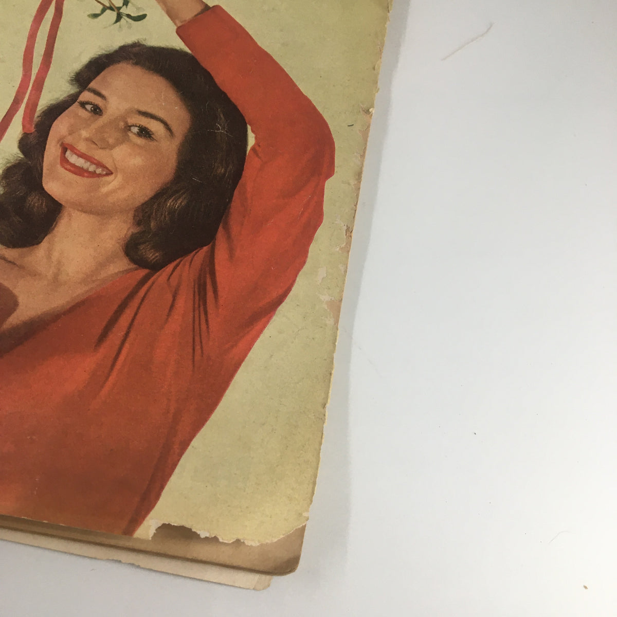 Cover image of VTG Family Circle Magazine December 1951 featuring a woman in a red dress holding mistletoe, exemplifying vintage holiday charm.