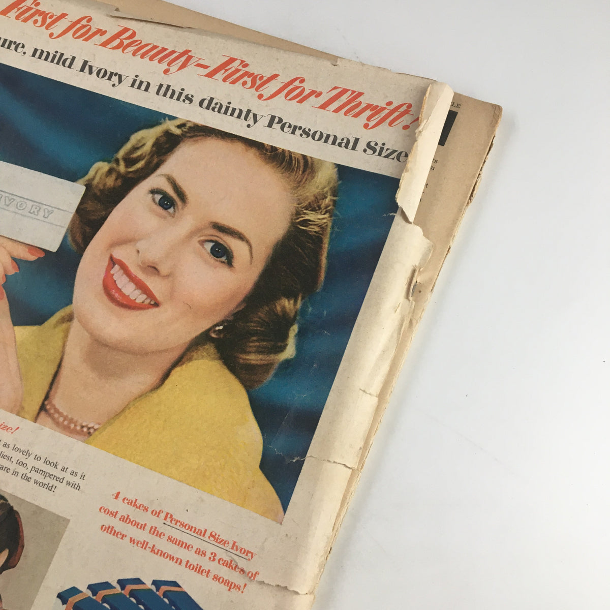 Back cover of VTG Family Circle Magazine December 1951 featuring a smiling woman with a beauty product, highlighting 1950s advertising styles.