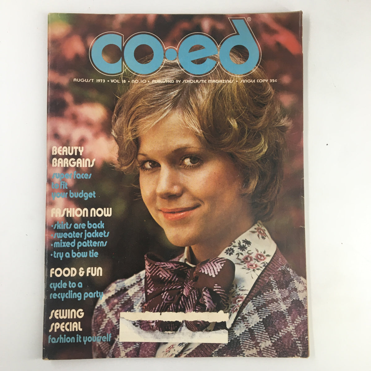 Vintage Co-Ed Magazine cover from August 1973 featuring the title 'Beauty Bargains: Super Faces to Fit Your Budget', highlighting 1970s fashion and beauty style.