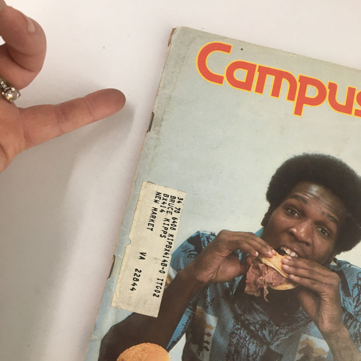 Cover of VTG Campus Life Magazine August 1976 featuring a man holding a sandwich with a label indicating former ownership.