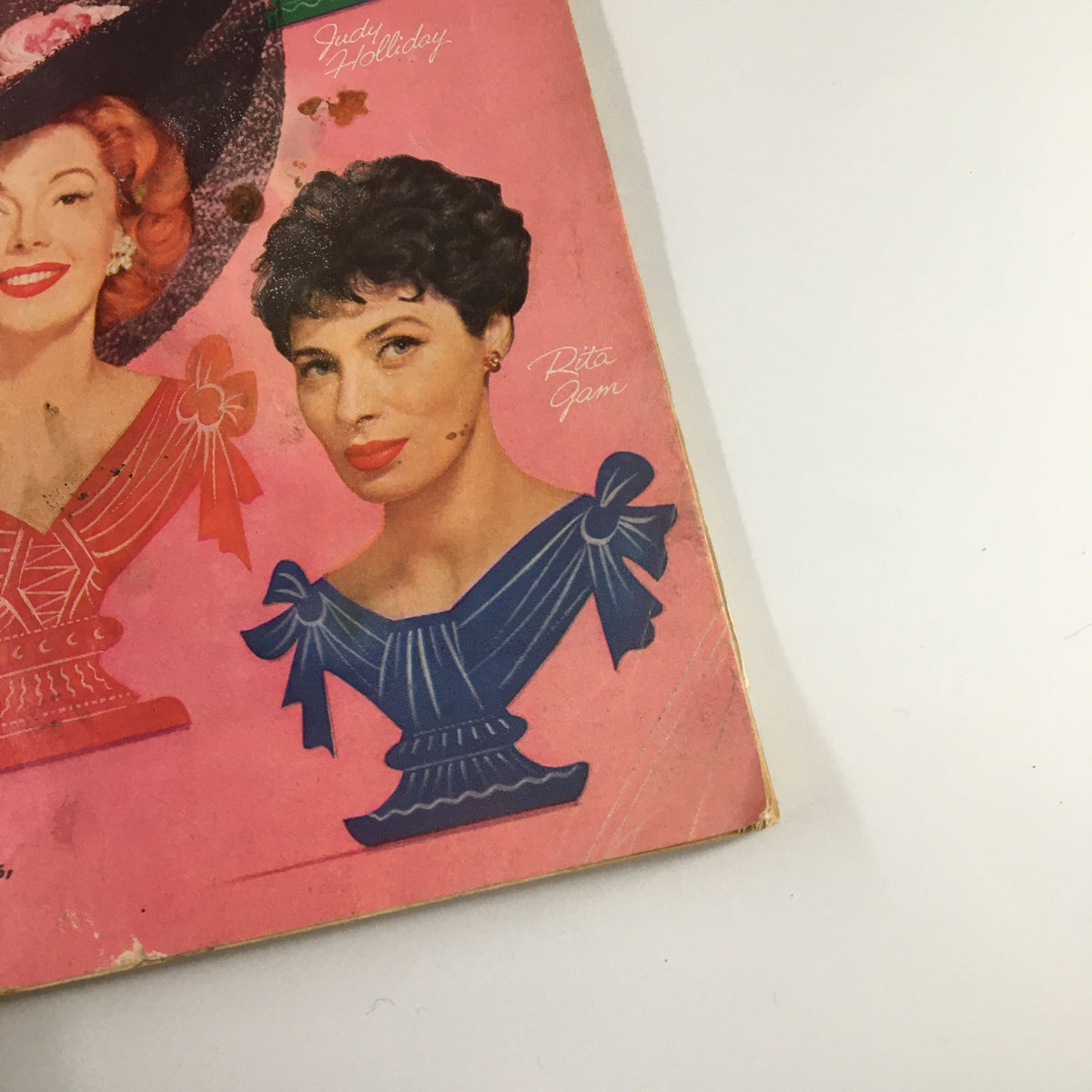 Detail view of VTG Family Circle Magazine September 1957 highlighting Judy Holliday and Rita Gam, showcasing their illustrations on the colorful magazine cover.