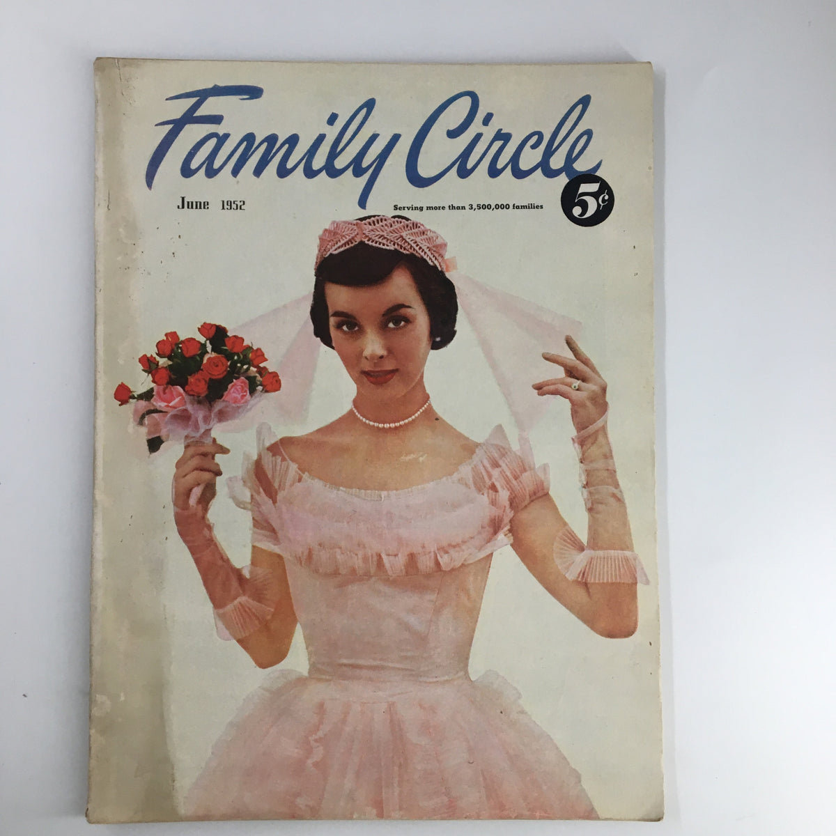 Cover of Family Circle Magazine June 1952 featuring a bride in a pink wedding dress holding a bouquet, highlighting the theme 'The Bride Chooses Pink'.