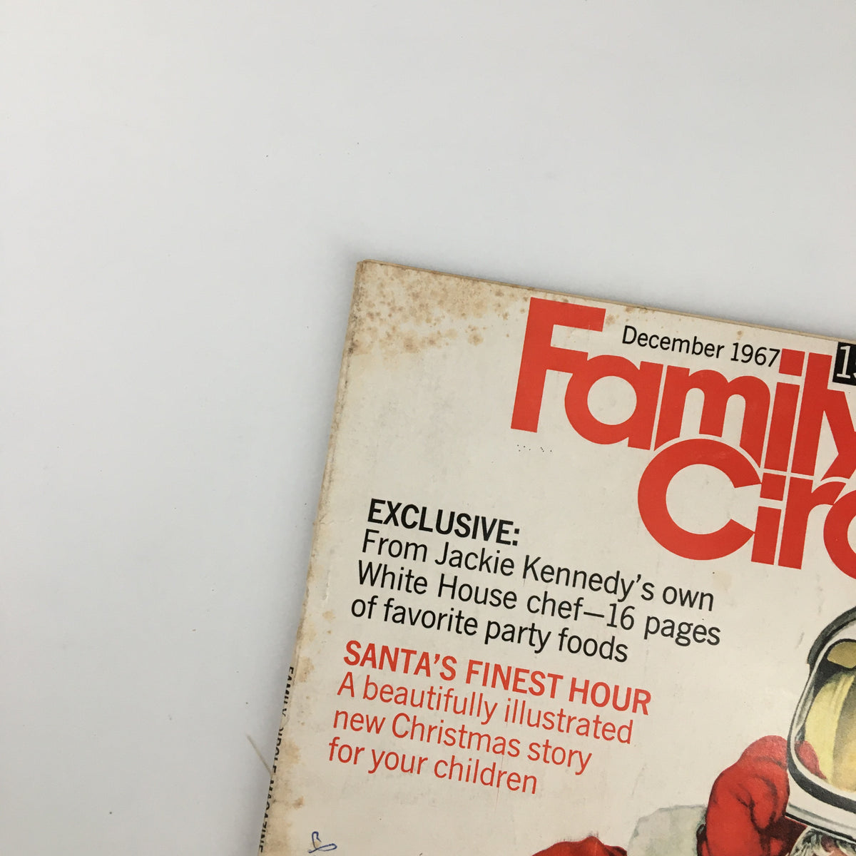 Detailed shot of the cover of VTG Family Circle Magazine December 1967 showcasing the title Santa Claus' Finest Hour and vintage holiday imagery.