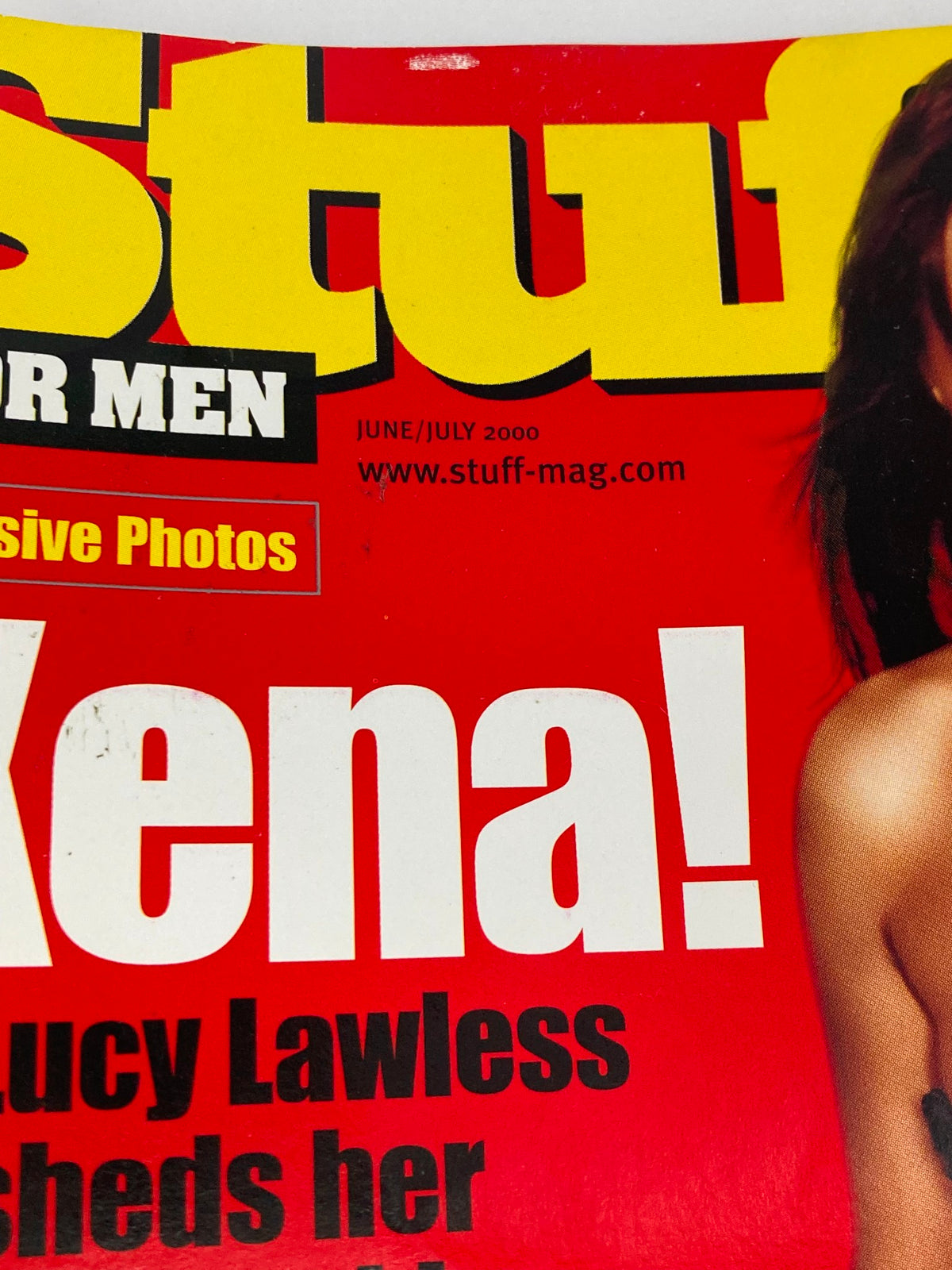 Cover of the Stuff for Men Magazine, June 2000, featuring Lucy Lawless, highlighting her iconic role as Xena with bold text proclaiming 'Xena!'. The magazine captures the essence of early 2000s culture and style, making it a collectible item.