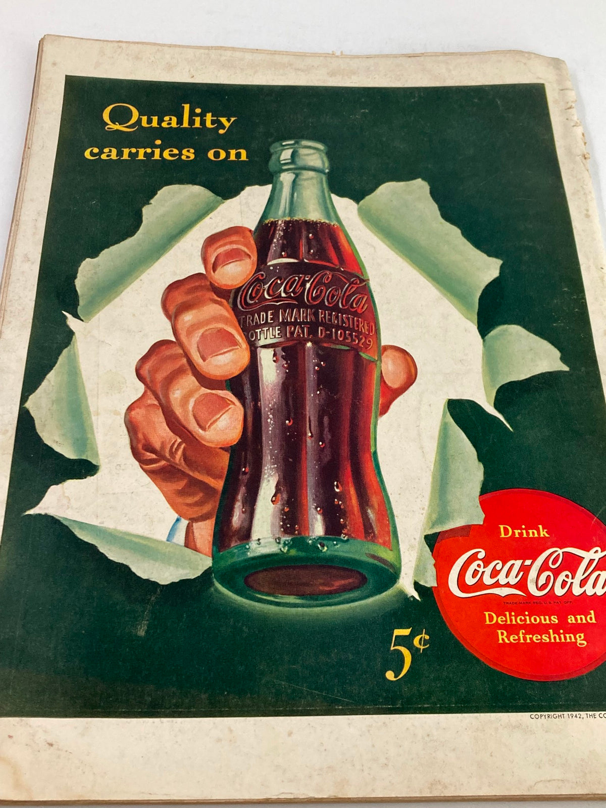 Cover of the VTG Life Magazine May 4 1942 featuring an artistic illustration of a hand holding a Coca-Cola bottle, with the caption 'Quality carries on' and 'Drink Coca-Cola Delicious and Refreshing', offered for 5¢. The magazine is in acceptable condition with visible wear.