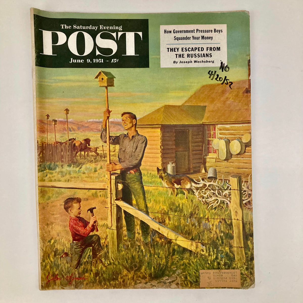 Vintage magazine cover of Saturday Evening Post from June 9, 1951, illustrated by John Clymer, featuring a father and son building a birdhouse on a picturesque farm.