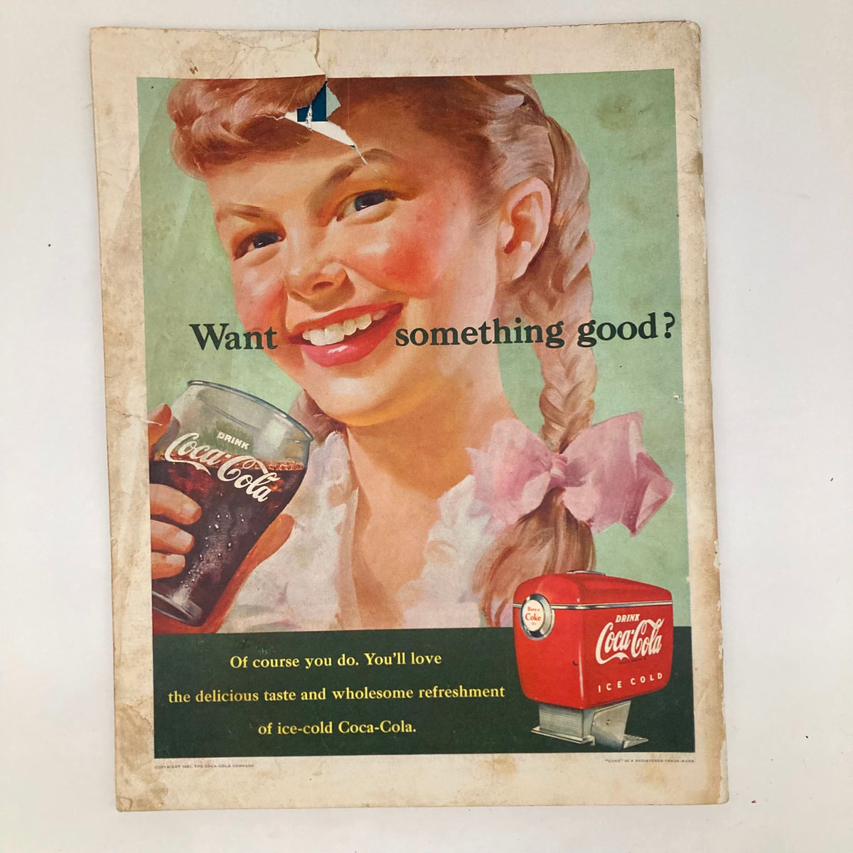 Vintage Coca-Cola advertisement from Saturday Evening Post Magazine October 6 1951, featuring a smiling girl holding a glass of Coke. The ad invites readers to enjoy something good, capturing the nostalgic appeal of the 1950s.