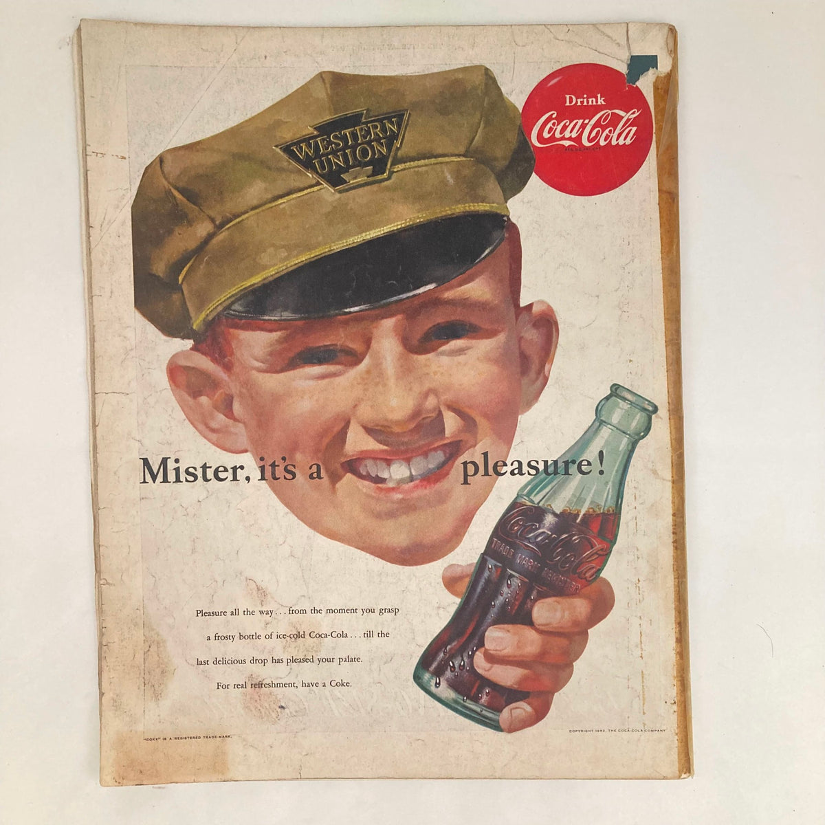 Cover of Saturday Evening Post Magazine January 26 1952 featuring a smiling boy in a Western Union cap holding a Coca-Cola bottle, with a vintage advertisement slogan that reads 'Mister, it's a pleasure!'