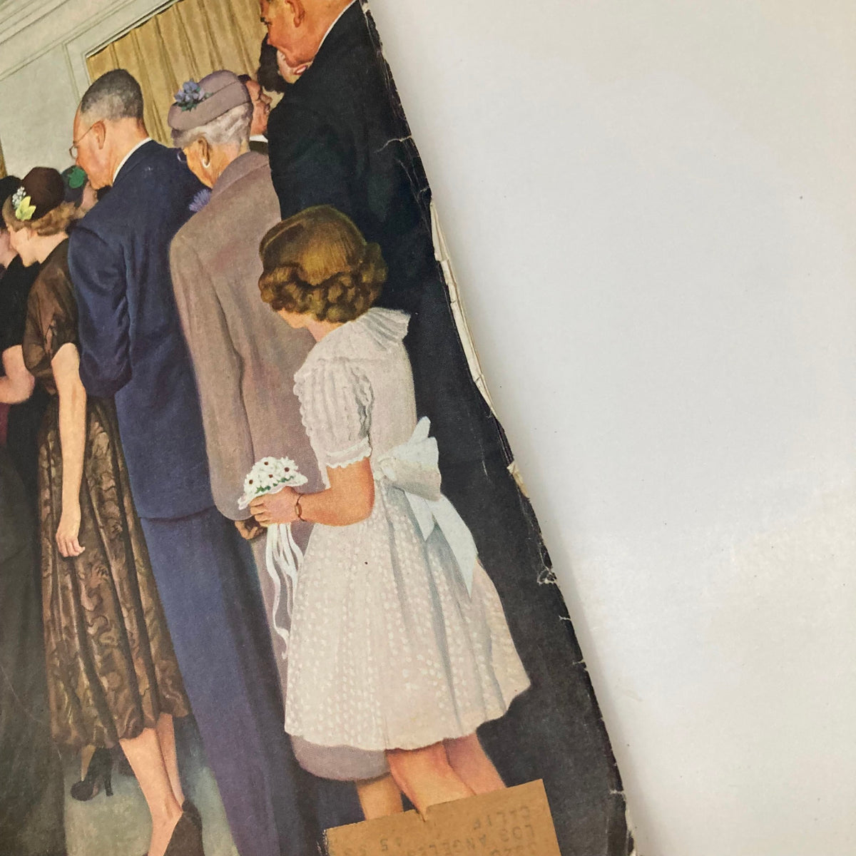 Close-up view of the rear side of the Saturday Evening Post Magazine June 16 1951, featuring a young girl in a white dress holding flowers, capturing the essence of mid-20th century American gatherings.