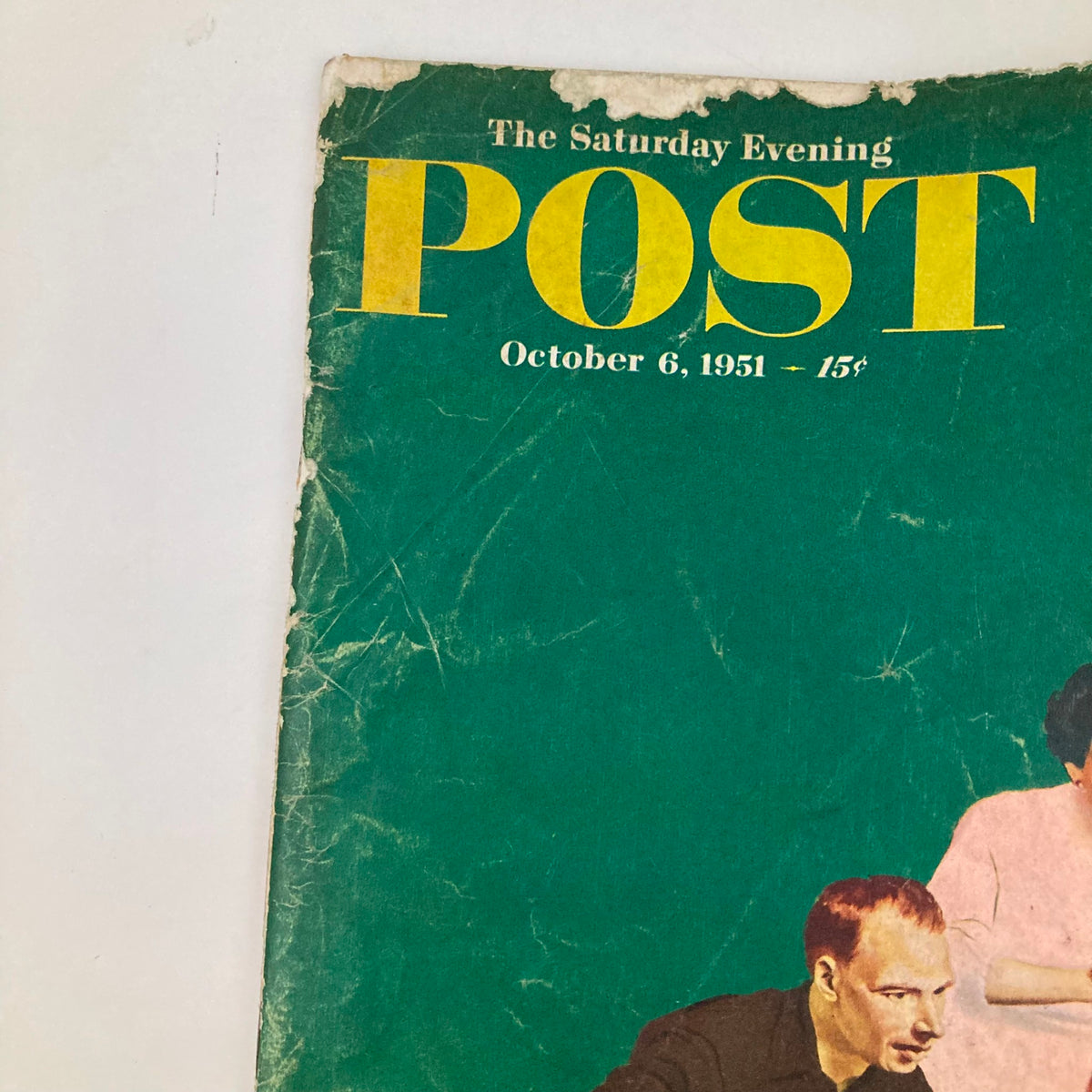 Close-up view of the Saturday Evening Post Magazine Cover - October 6, 1951, showcasing the title and date with worn edges, highlighting its vintage charm.