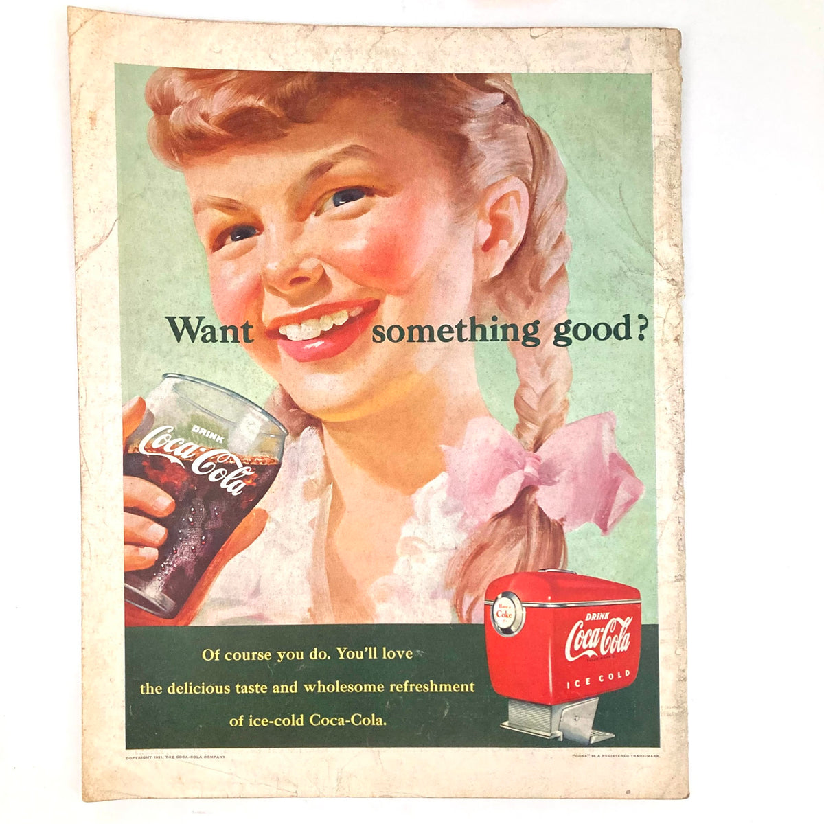 Vintage Coca-Cola advertisement from Saturday Evening Post Magazine October 6, 1951 showing a smiling girl holding a glass of Coca-Cola.