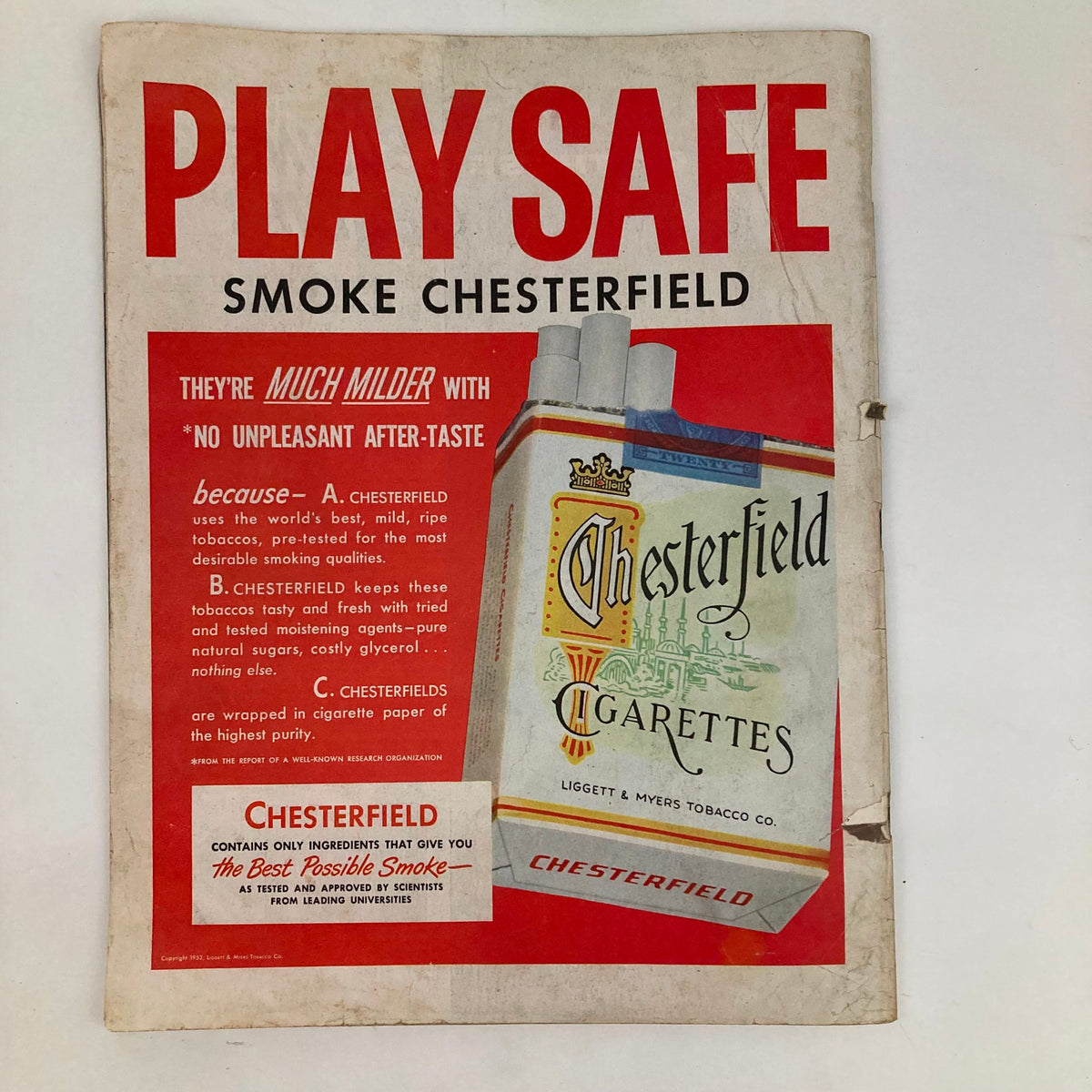Vintage advertisement for Chesterfield cigarettes featured on the cover of Saturday Evening Post Magazine August 23, 1952, highlighting its mild smoking qualities and branding.