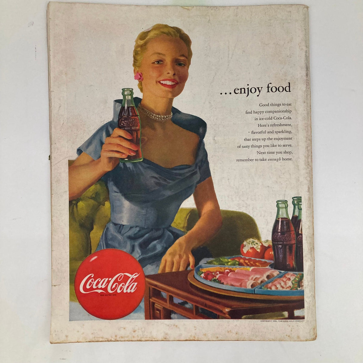 Saturday Evening Post Magazine July 12 1952 featuring a vintage Coca-Cola advertisement with a smiling woman in a blue dress, promoting joy and enjoyment through food and refreshments.