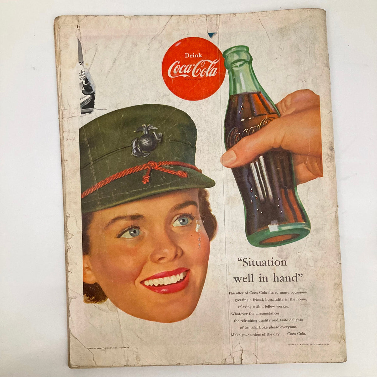 Coca-Cola advertisement from February 21 1953, in Saturday Evening Post Magazine, featuring a smiling woman in military uniform holding a Coca-Cola bottle with the slogan 'Situation well in hand'.