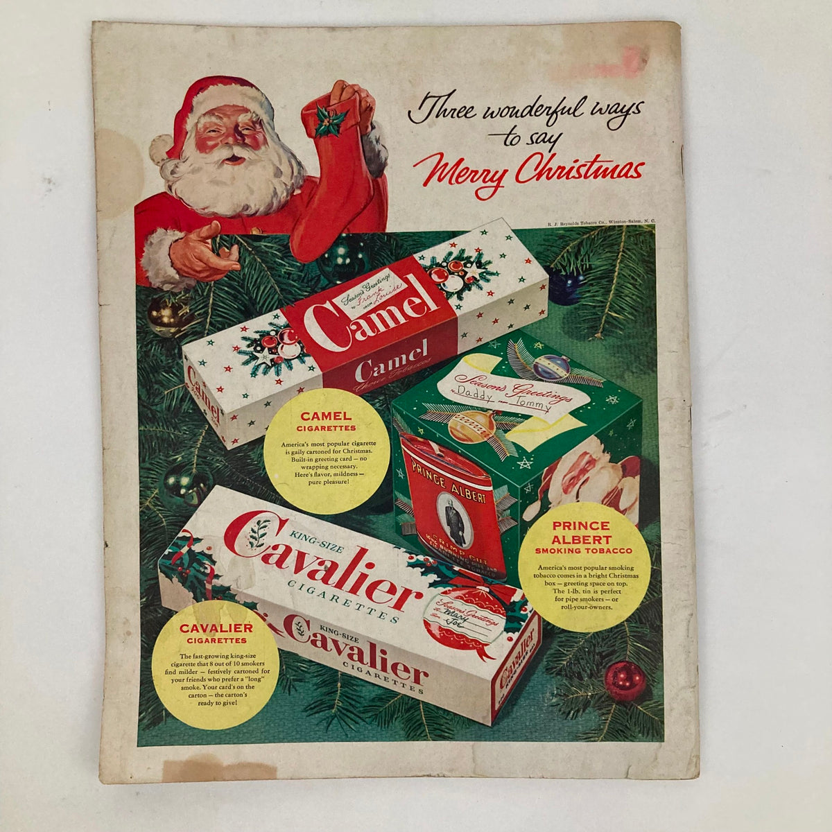 Holiday-themed advertisement featuring Camel and Cavalier cigarettes, with Santa Claus and festive decorations in the Saturday Evening Post Magazine December 12, 1953 - Tired Dad by George Hughes.
